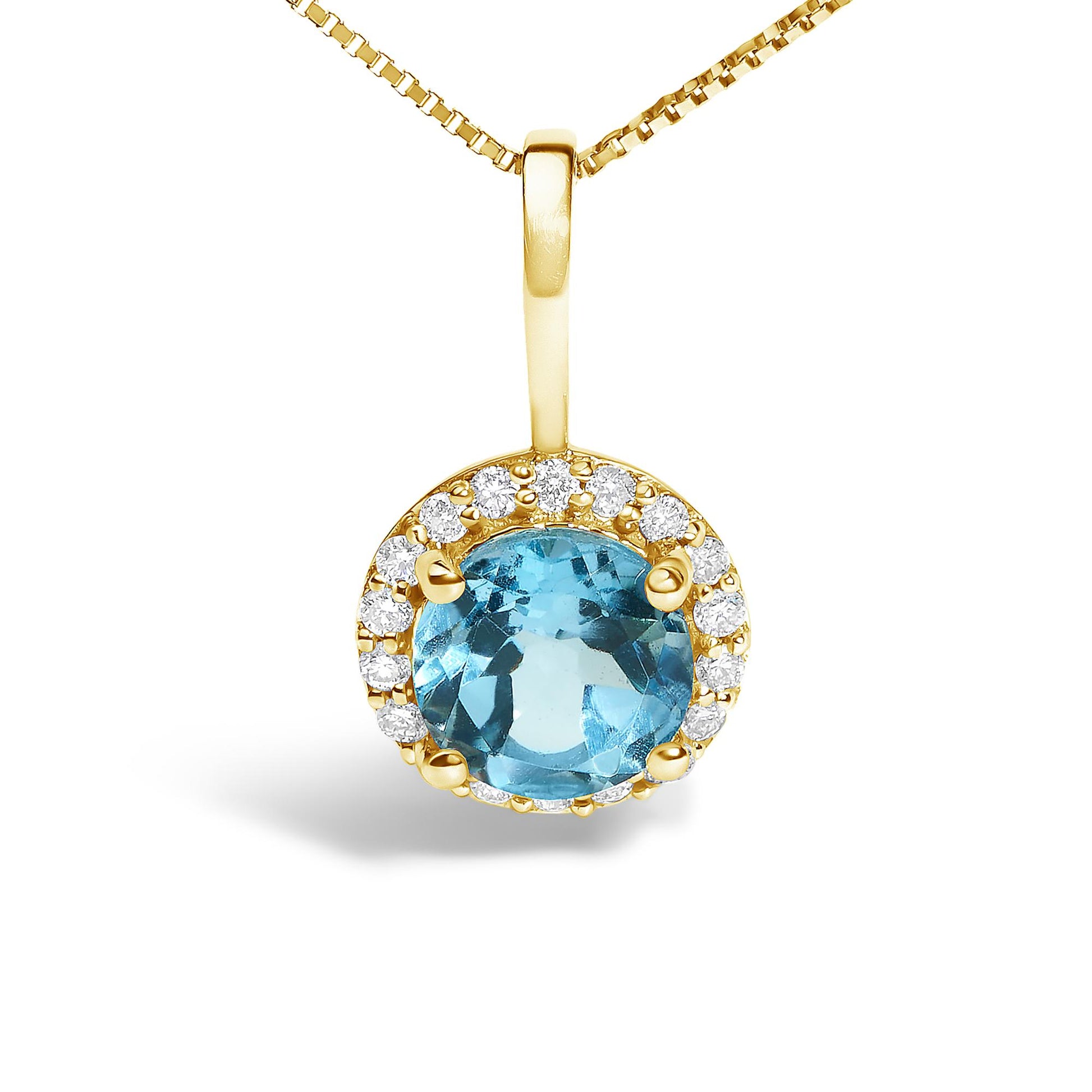 Close-up front view of a yellow metal necklace pendant featuring a round blue gemstone in a four-prong setting, surrounded by a halo of small round white gemstones in a shared prong setting.