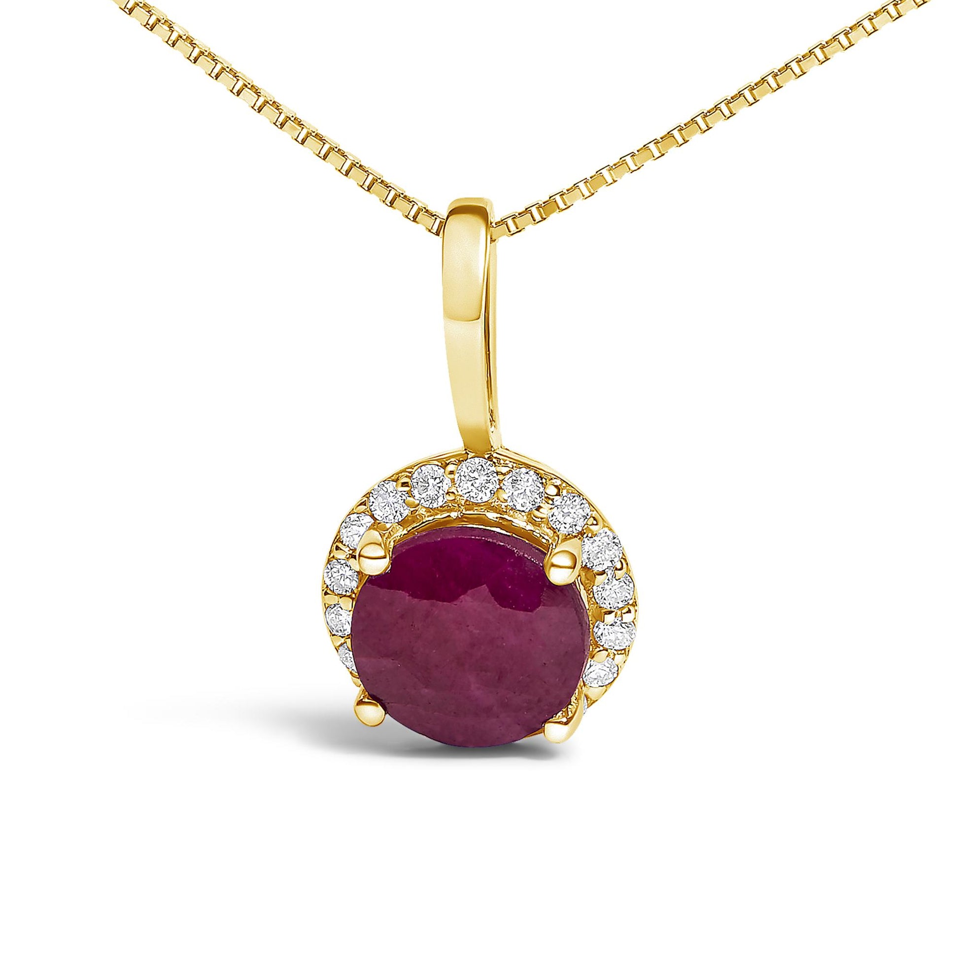 Close-up front view of a yellow necklace pendant with a round red gemstone held by four prongs, surrounded by a semi-circle of round white gemstones in shared prong settings.
