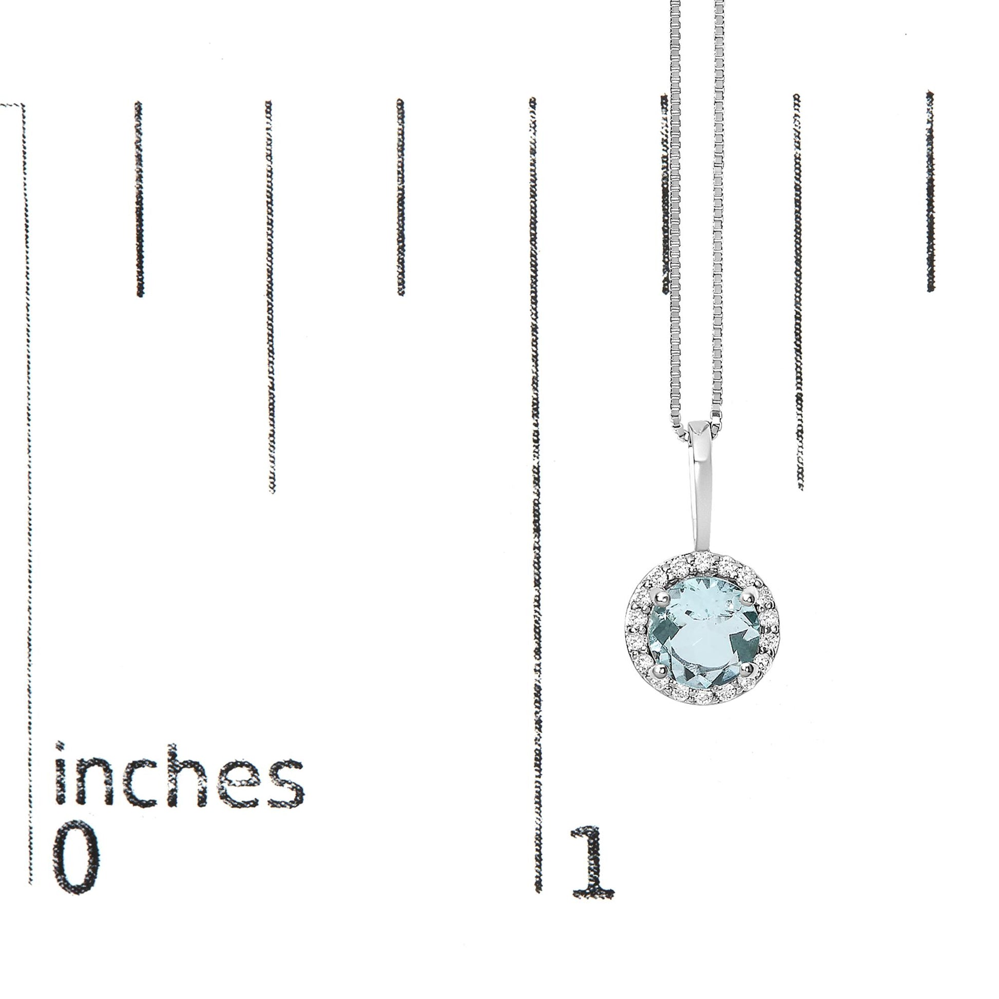 White metal necklace with a round blue gemstone center surrounded by small white gemstones, shown hanging on a ruler scale from a top-front angle.