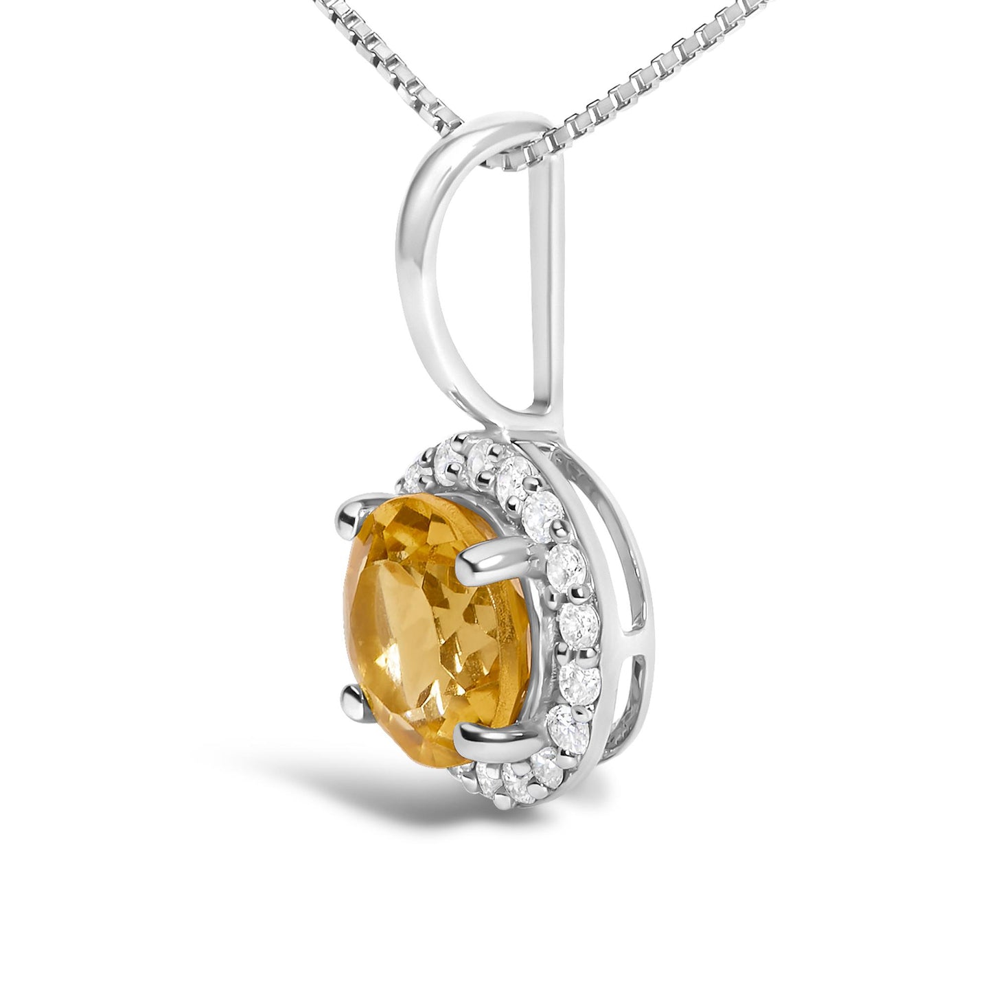 Close-up front angled view of a white metal necklace pendant featuring a round orange gemstone in a four-prong setting, surrounded by multiple small round white gemstones in a shared prong setting.