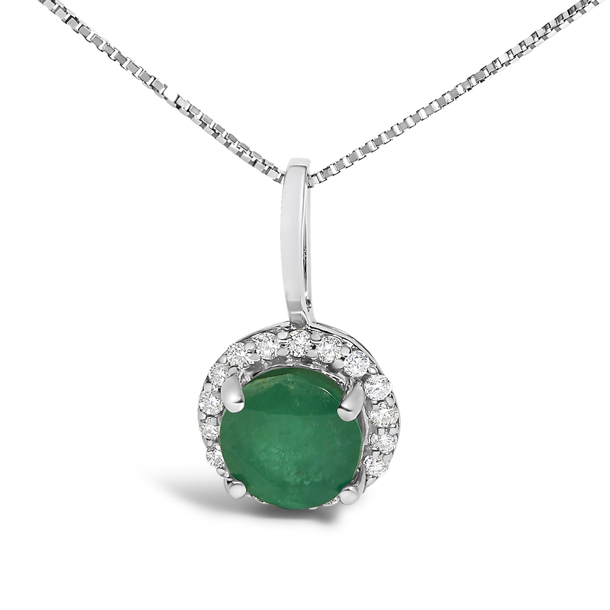 Close-up front view of a white metal necklace with a round green gemstone pendant surrounded by a halo of small round white gemstones in shared prong settings.