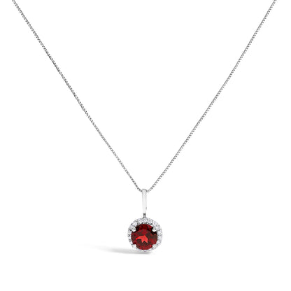Front view of a white metal necklace with a round red gemstone pendant surrounded by a circle of round white gemstones, shown on a white background.