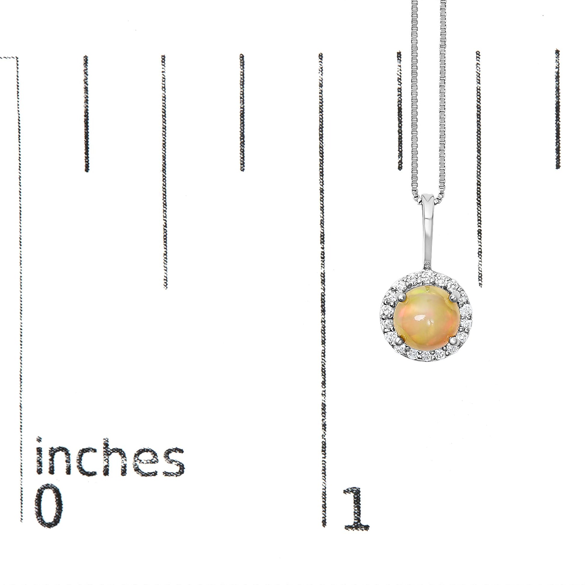 Close-up front view of a white necklace with a round multi-color opal gemstone in a 4-prong setting, surrounded by round white gemstones in a shared prong setting, shown on a scale.