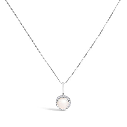 White metal necklace with a round pendant featuring a central smooth gemstone surrounded by a halo of small round white gemstones in shared prong setting, shown against a white background from a front angle.