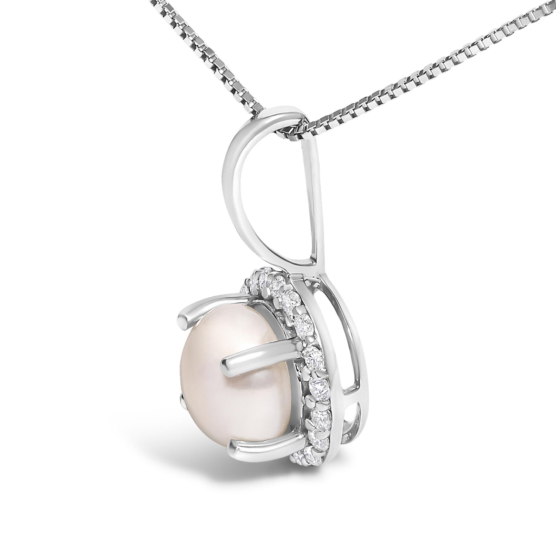 Close-up side angle of a white necklace pendant featuring a round central light pink gemstone held by prongs, surrounded by a row of small round white gemstones in a shared prong setting. The pendant is attached to a white chain.