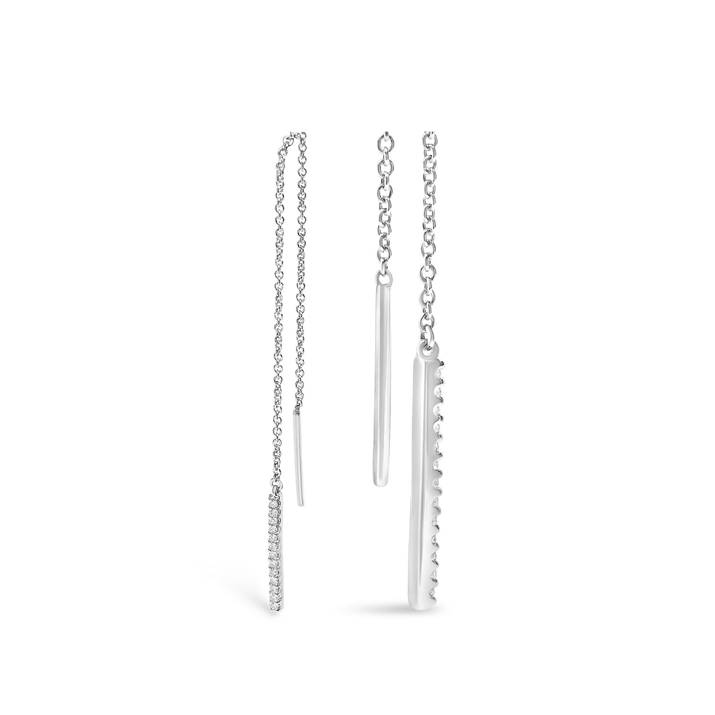 Front and side view of a pair of white metal earrings with a thin chain and a vertical bar pendant adorned with small white gemstones in a micro-pave setting, shown against a white background.