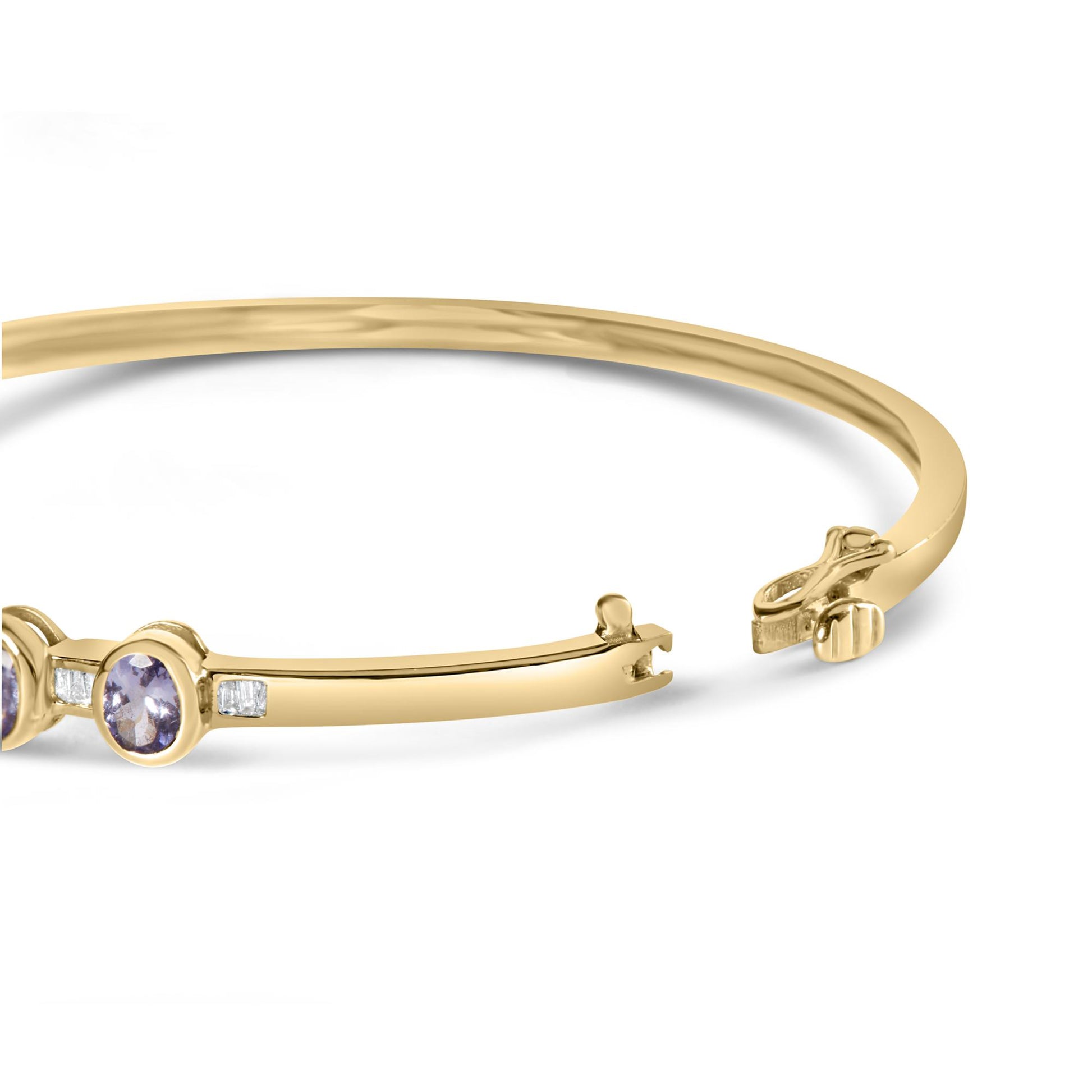 Yellow metal bracelet with oval purple gemstones in bezel settings and small white baguette-shaped gemstones in channel settings, shown from a side angle with open clasp.