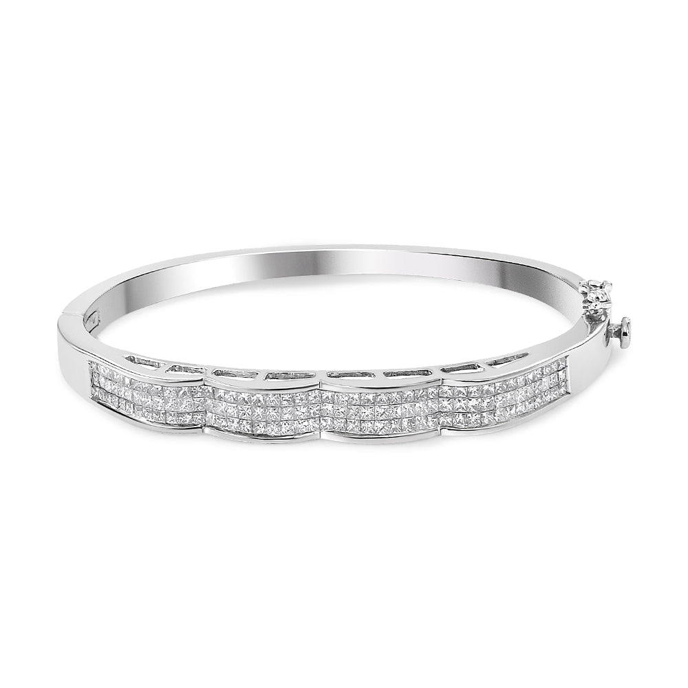 White metal bracelet with rows of princess-shaped white gemstones in invisible setting, shown at a slight angle.