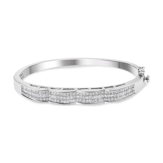 White metal bracelet with rows of princess-shaped white gemstones in invisible setting, shown at a slight angle.