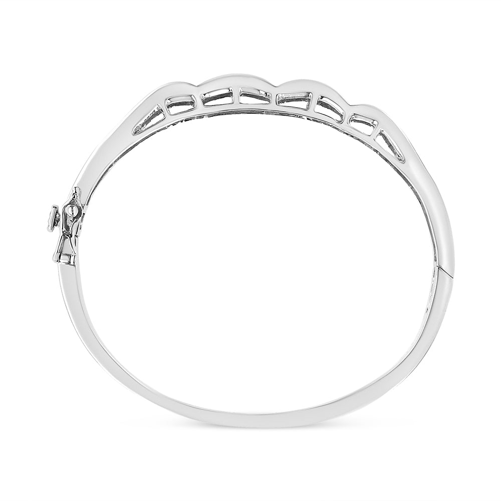 Top-down view of a white metal bracelet with princess-shaped white gemstones set invisibly along the top edge.