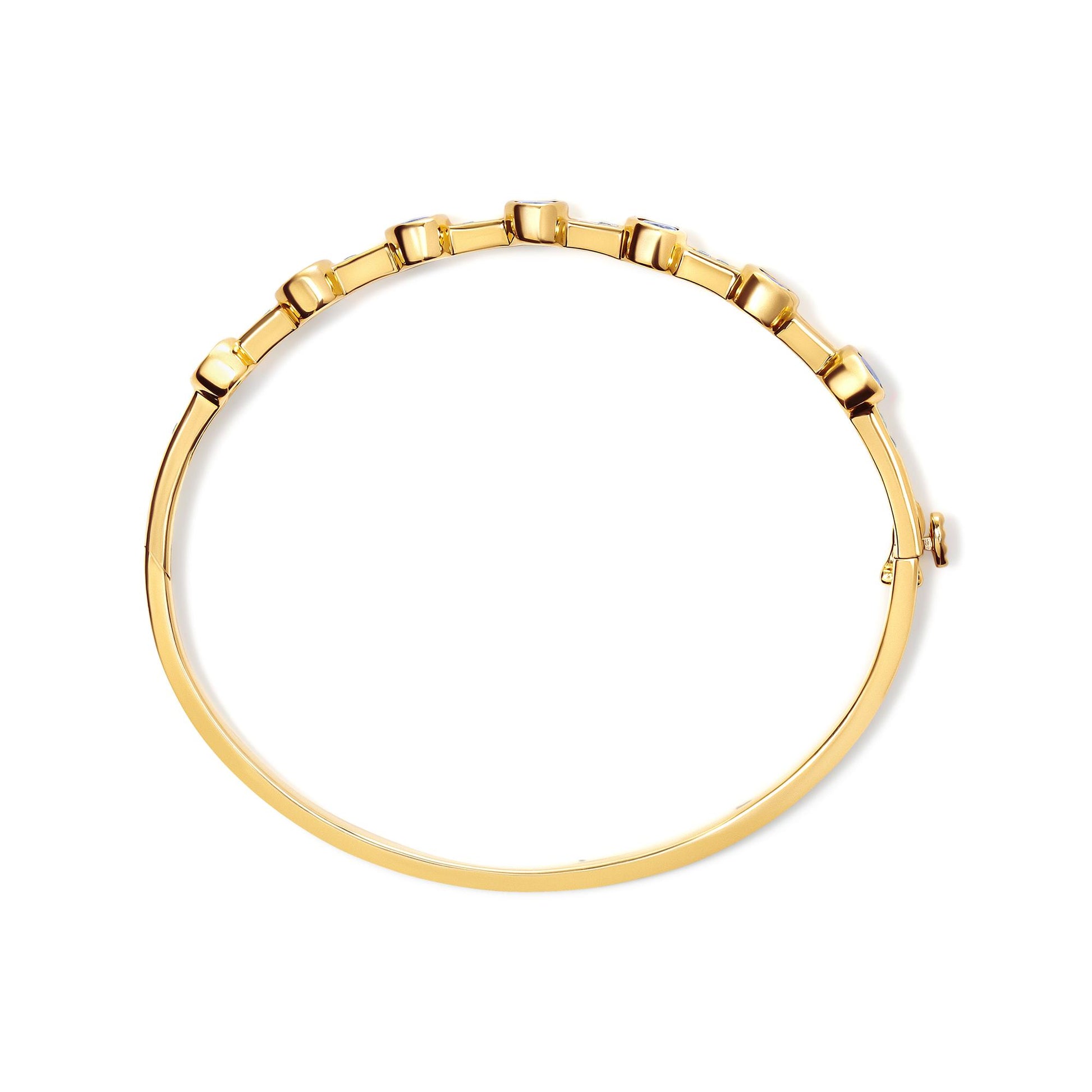 Top-down view of a yellow bracelet with round white gemstones set in a channel and oval blue gemstones in bezel settings along the top.
