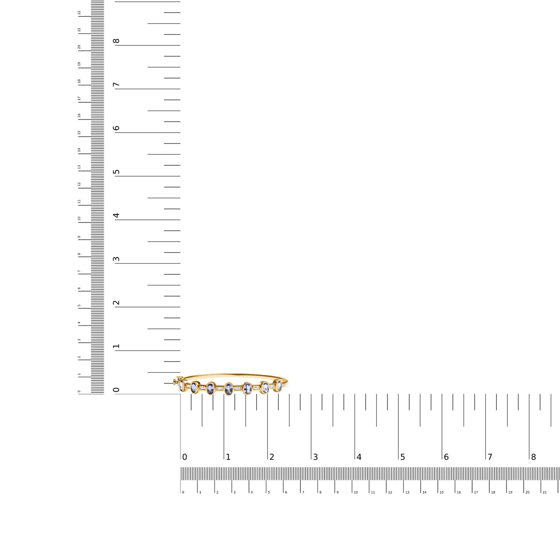 Yellow bracelet with oval blue gemstones in bezel settings and round white gemstones in channel settings, shown on a ruler for size reference, photographed from a top-front angle.