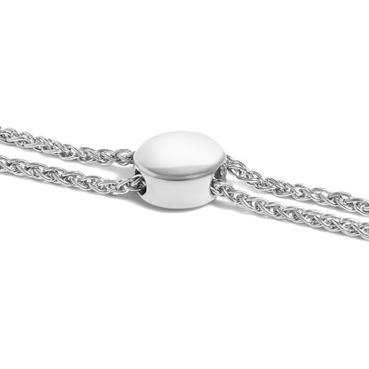 Close-up side angle of a white metal bracelet featuring a smooth oval bead and two twisted chain strands.