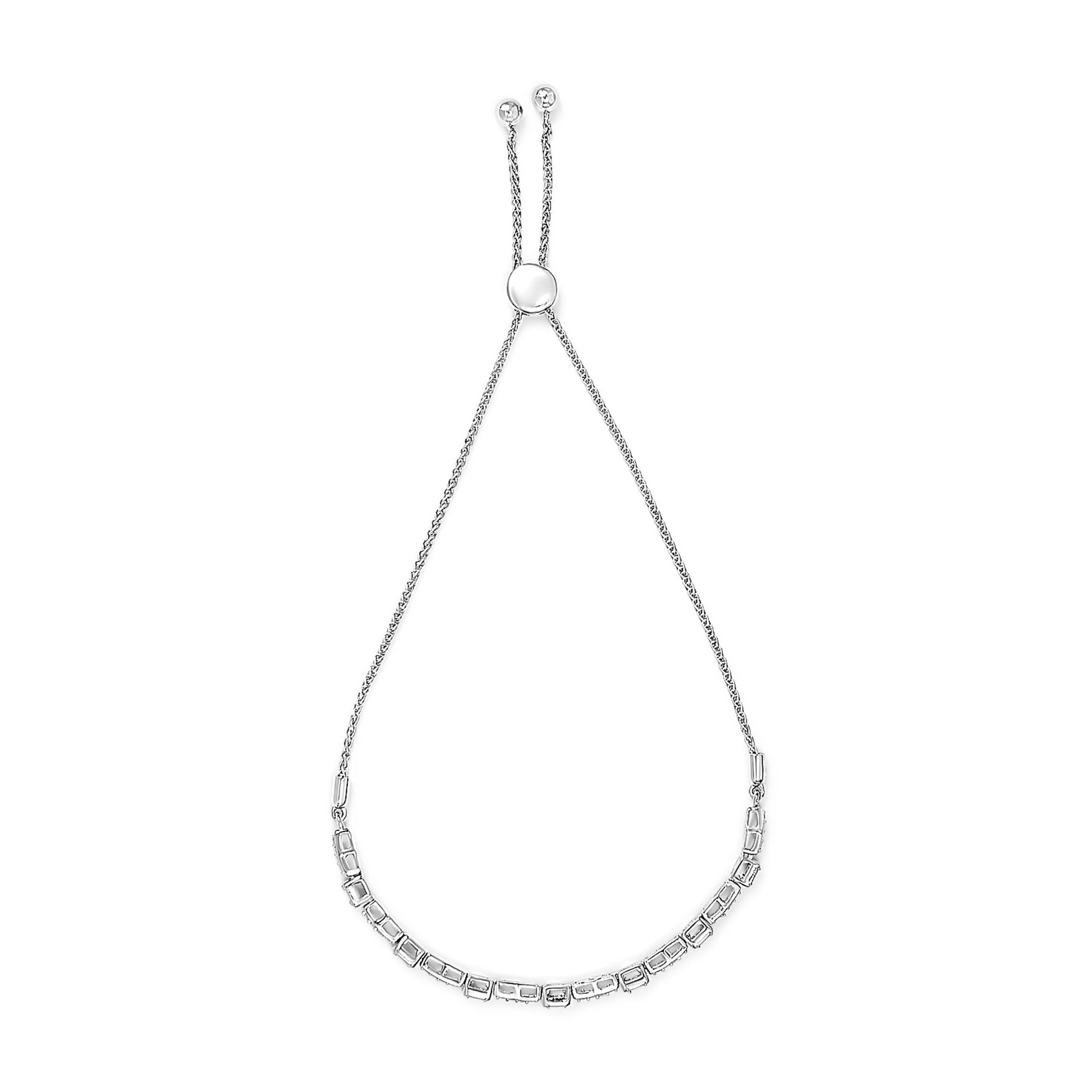 Top-down view of a white metal bracelet featuring a row of white gemstones in prong settings along the bottom curve, with an adjustable sliding clasp and two gemstone accents at the ends of the chain.