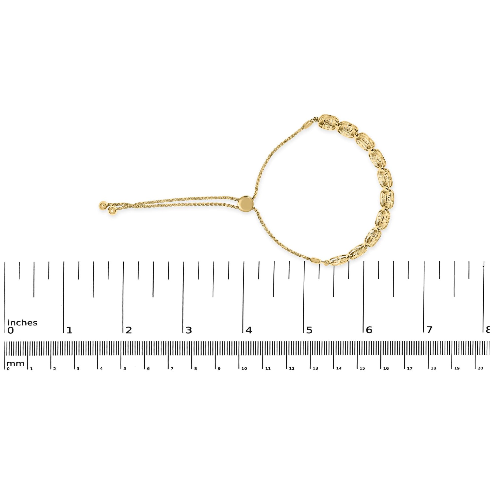 Yellow bracelet with round white gemstones in prong settings, shown flat on a ruler for size reference, top-down angle.