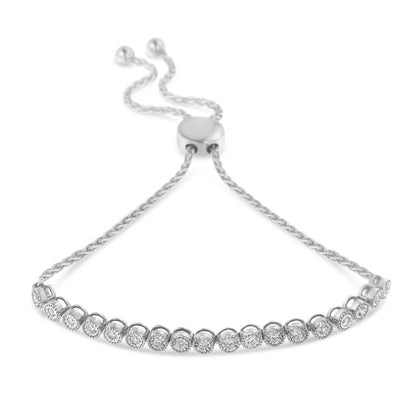 White metal bracelet with round white gemstones in miracle settings, shown at a slight angle from above.