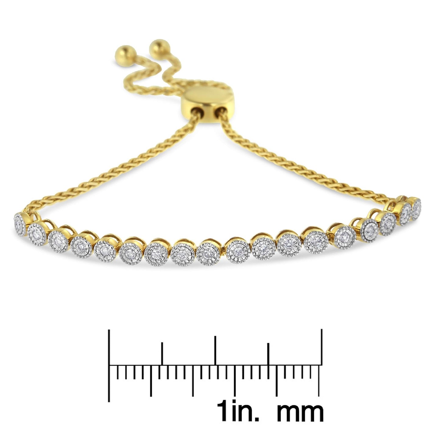 Yellow metal bracelet with round white gemstones in miracle setting, displayed on a ruler for size reference, angled front view.
