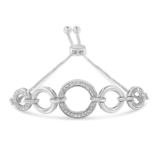 White metal bracelet with alternating plain and pave-set round white gemstone circles, viewed from the front angle.