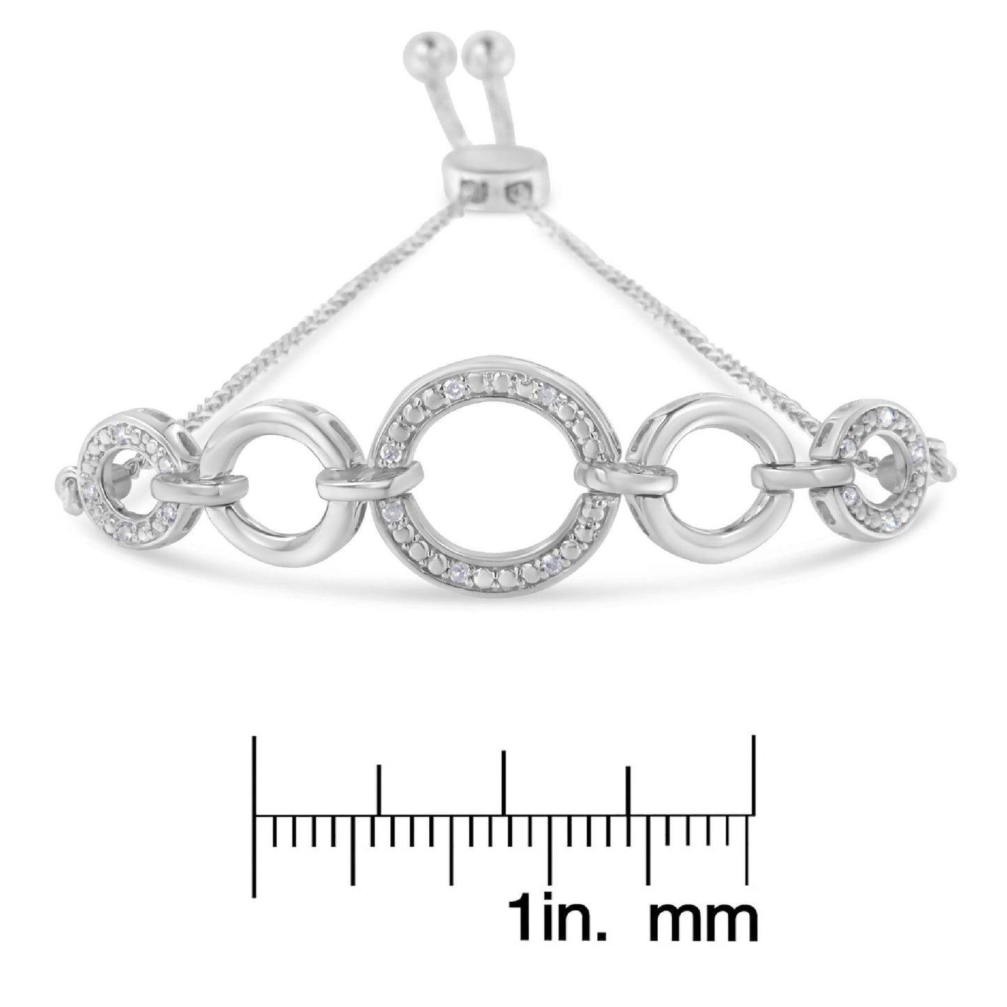 White metal bracelet with alternating plain and pave-set round white gemstones in circular links, shown from the front on a ruler for size reference.