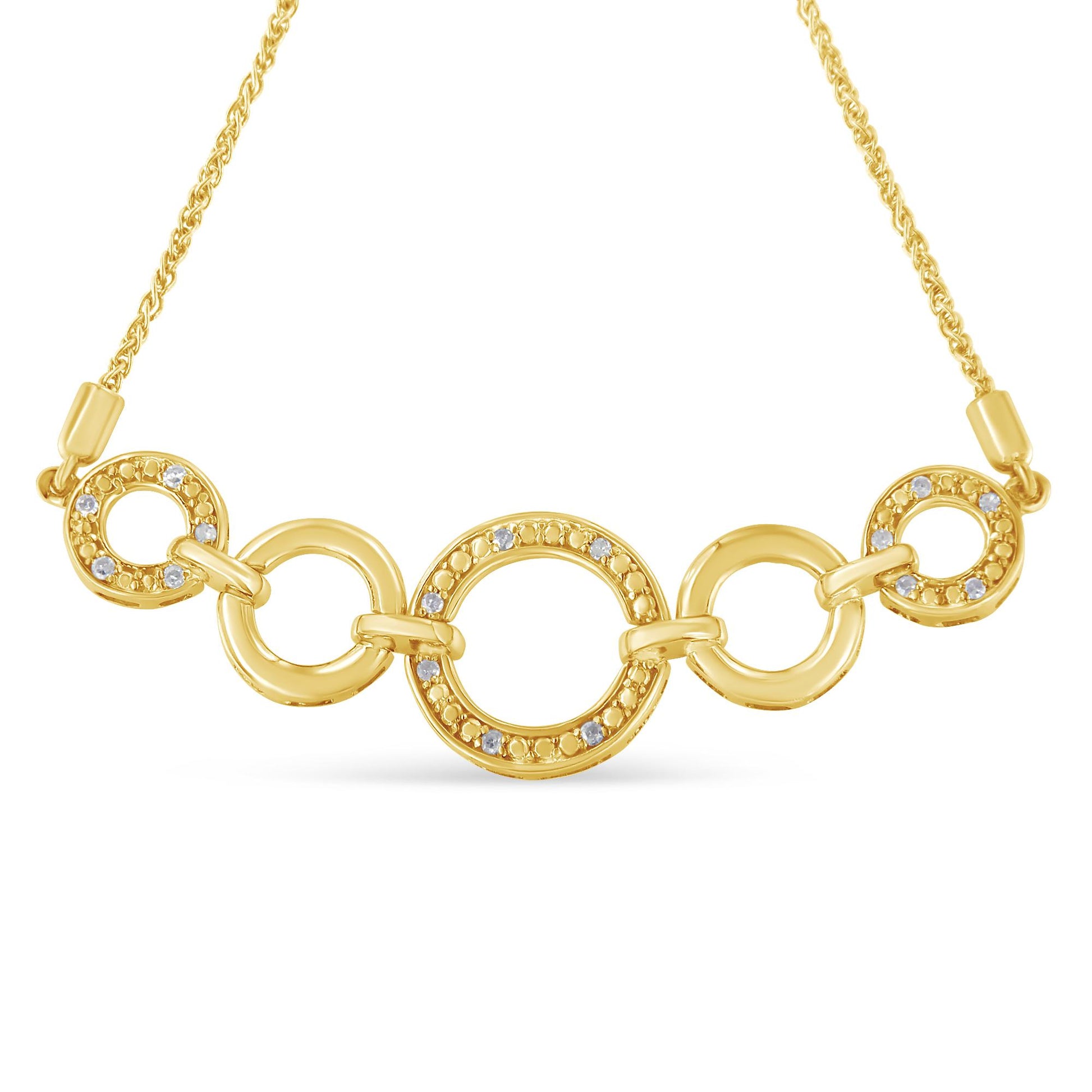 Front-facing view of a yellow metal bracelet with interconnected circular links, three of which are adorned with round white gemstones in a pave setting.