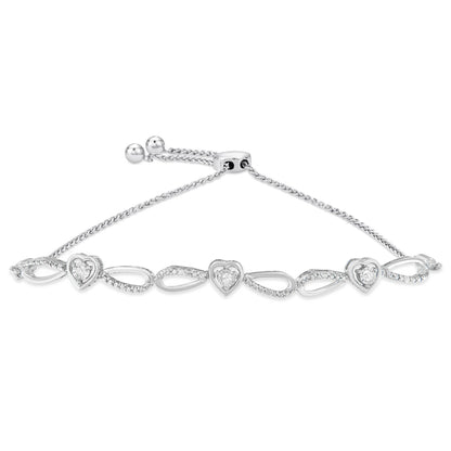 White metal bracelet with heart-shaped and teardrop-shaped links, each heart set with a round white gemstone, shown from a front angle.
