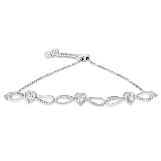 White metal bracelet with heart-shaped and teardrop-shaped links, each heart set with a round white gemstone, shown from a front angle.