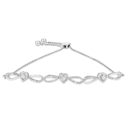 White metal bracelet with alternating open heart and teardrop shapes, each heart featuring a round white gemstone in prong setting, shown from a top angle.