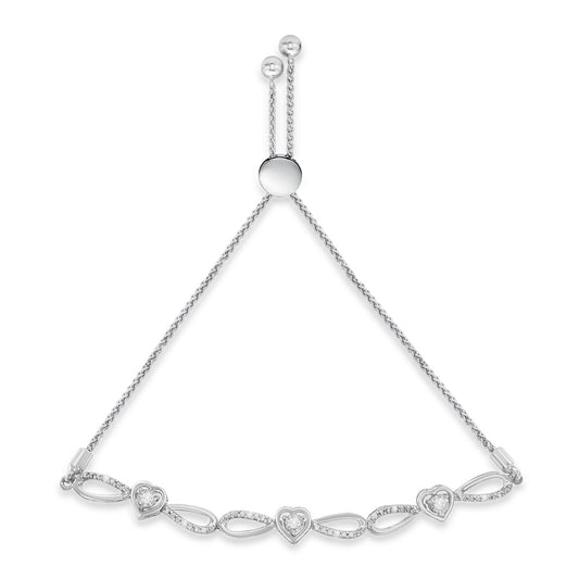 White metal bracelet with heart-shaped and round white gemstones, adjustable chain slider, shown from a top-down angle.