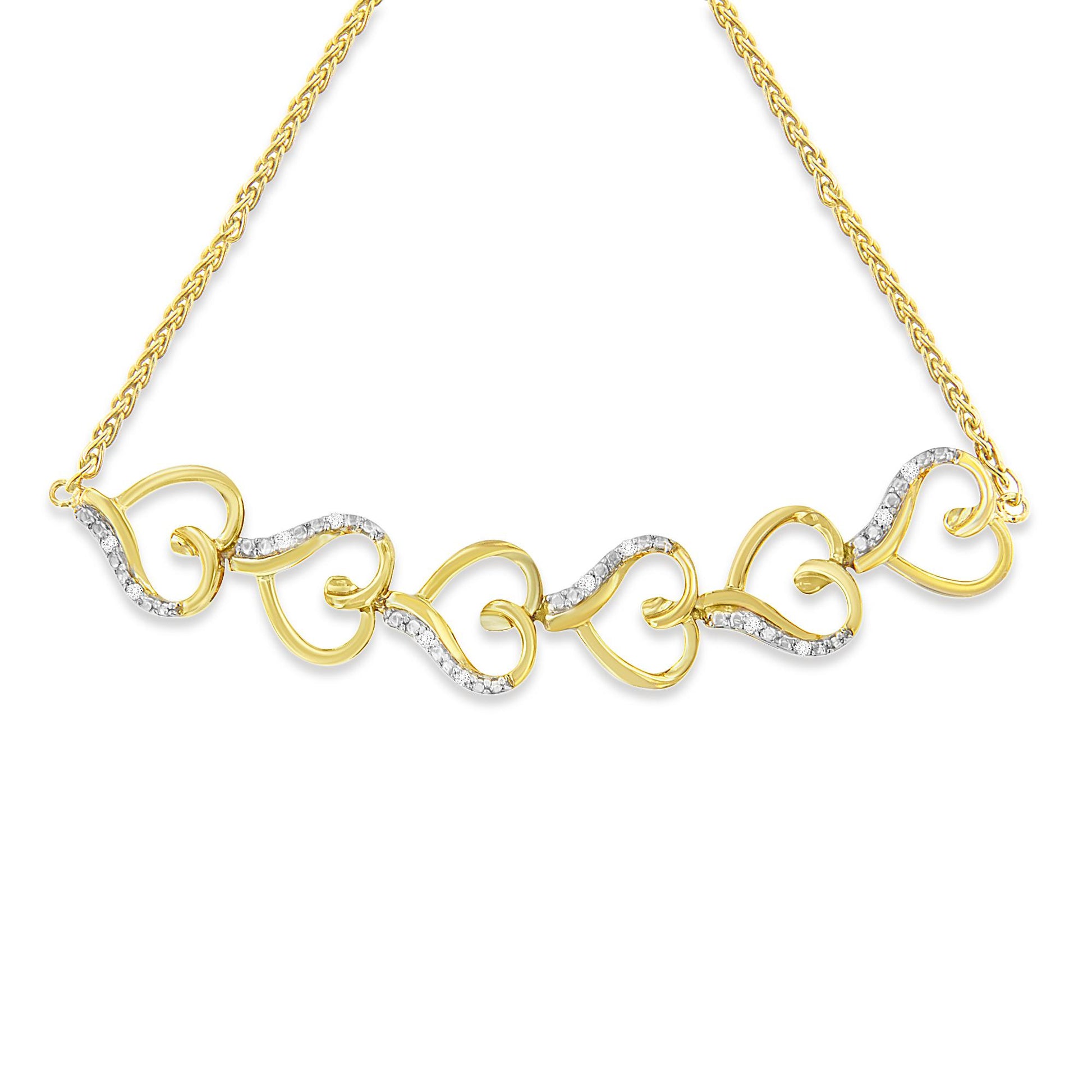 Front view of yellow metal bracelet with linked heart shapes, some accented with white round pave-set gemstones.