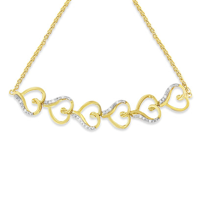 Front view of yellow metal bracelet with linked heart shapes, some accented with white round pave-set gemstones.