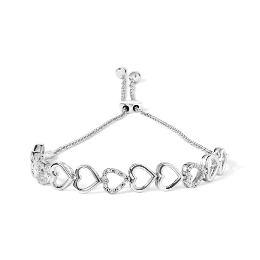 White metal heart link bracelet with alternating polished and white gemstone-set hearts, shown from front angle with adjustable sliding clasp.