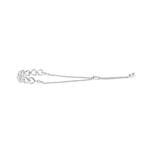 Side view of a white metal bracelet featuring linked open heart shapes and round white gemstones in prong settings, with adjustable sliding chain ends.