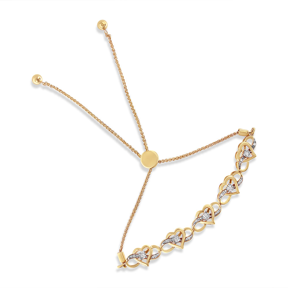 Yellow metal adjustable bracelet with heart-shaped links and white gemstones in prong and miracle settings, shown from a top-down angle on a white background.