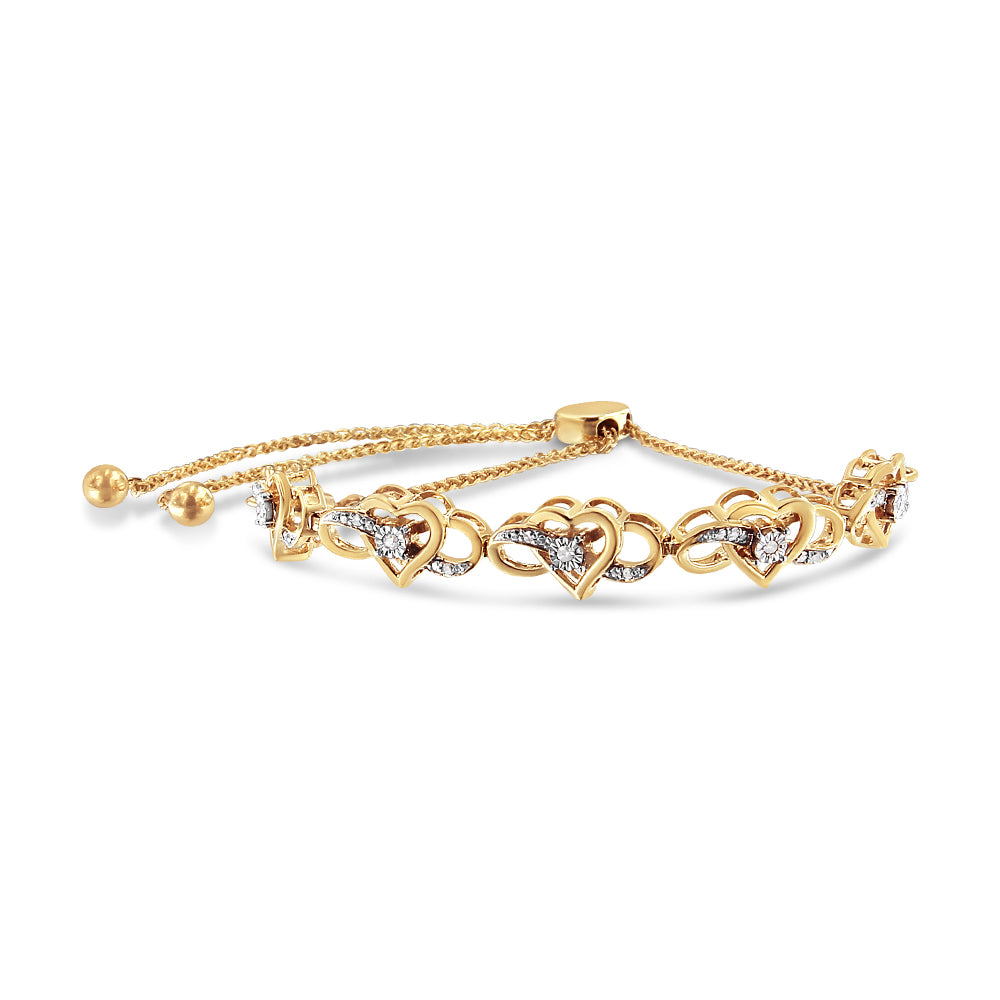 Yellow metal bracelet with heart-shaped links accented with white round gemstones in prong and miracle settings, shown in a front angled view.