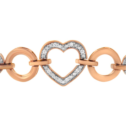 Close-up front view of a two-tone bracelet with rose-colored circular links and a heart-shaped link adorned with round white gemstones in a pave setting.