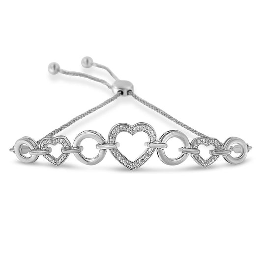 White metal bracelet with heart-shaped links set with small round white gemstones in pave setting, alternating with smooth circular links, adjustable pull-string closure, front-facing angle.