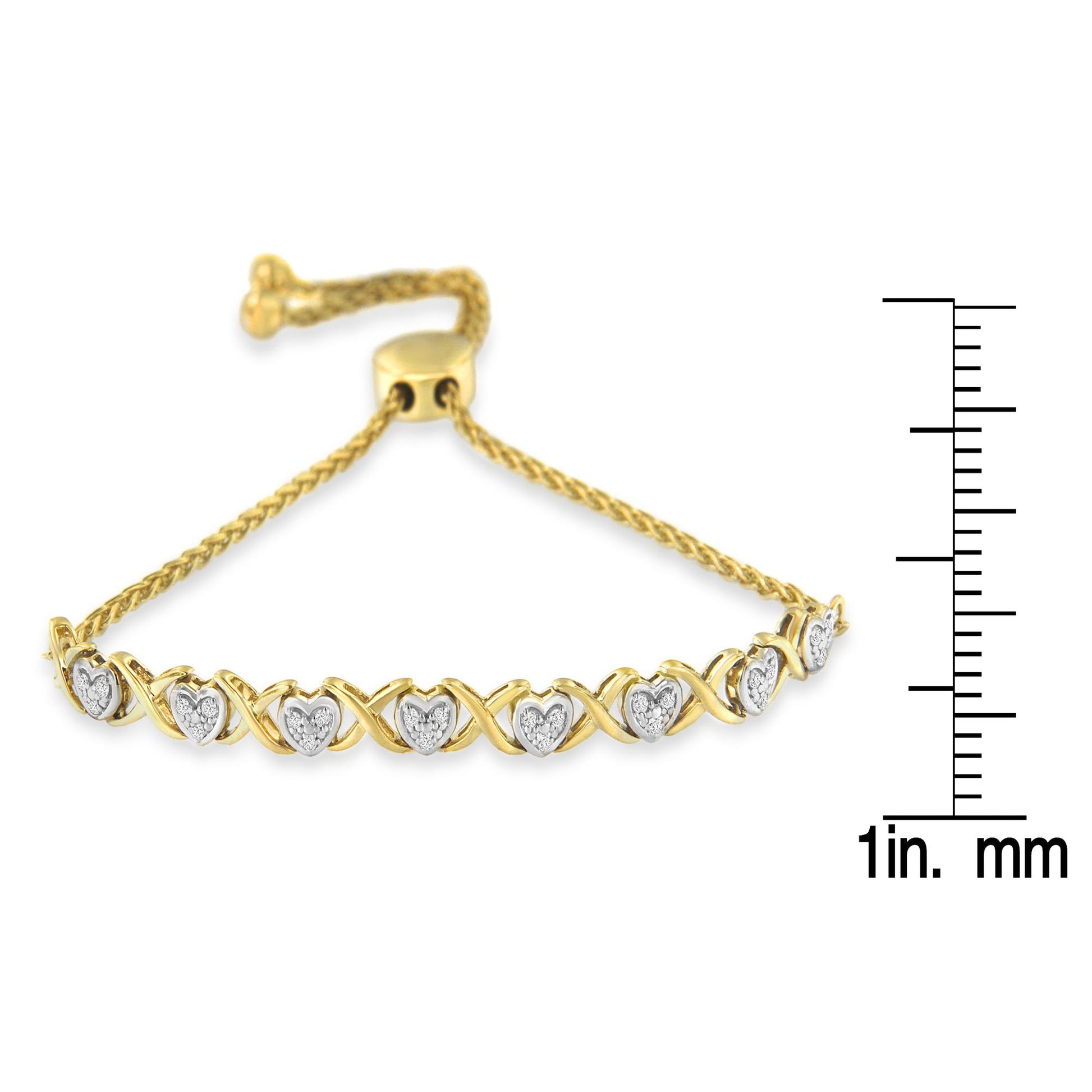 Yellow bracelet with alternating heart shapes inset with white gemstones and X-shaped links, shown in a close-up side view with a ruler for size reference.