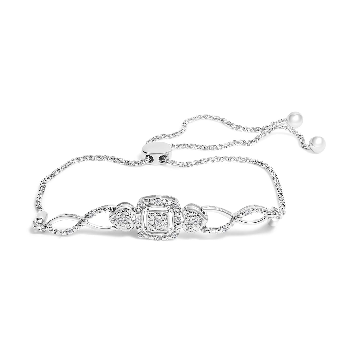 White metal bracelet with an adjustable chain, featuring heart and square motifs adorned with round white gemstones in pave setting, shown in a flat lay angled from above.