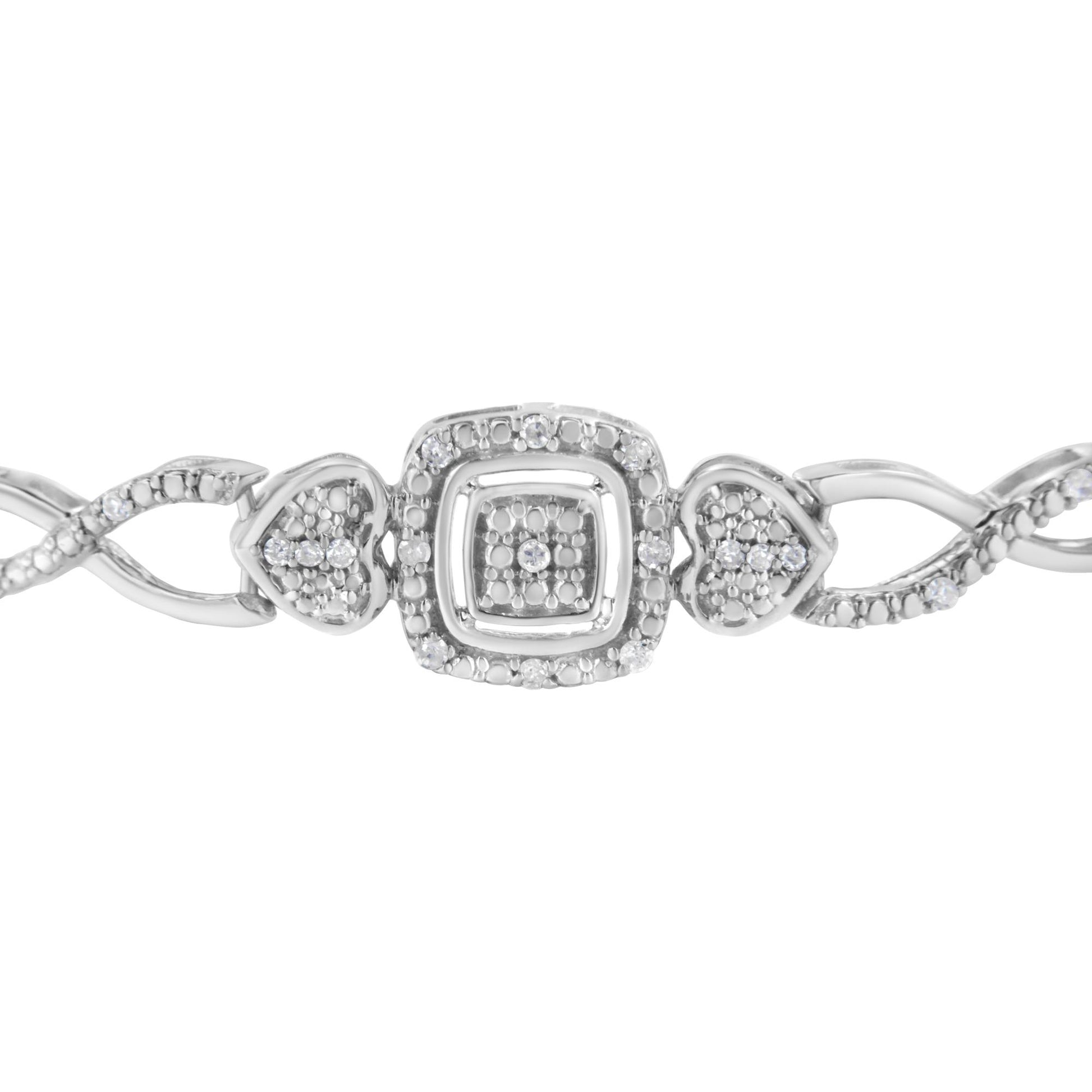 Close-up front view of a white metal bracelet featuring round white gemstones in pave setting, with heart-shaped and square decorative elements.