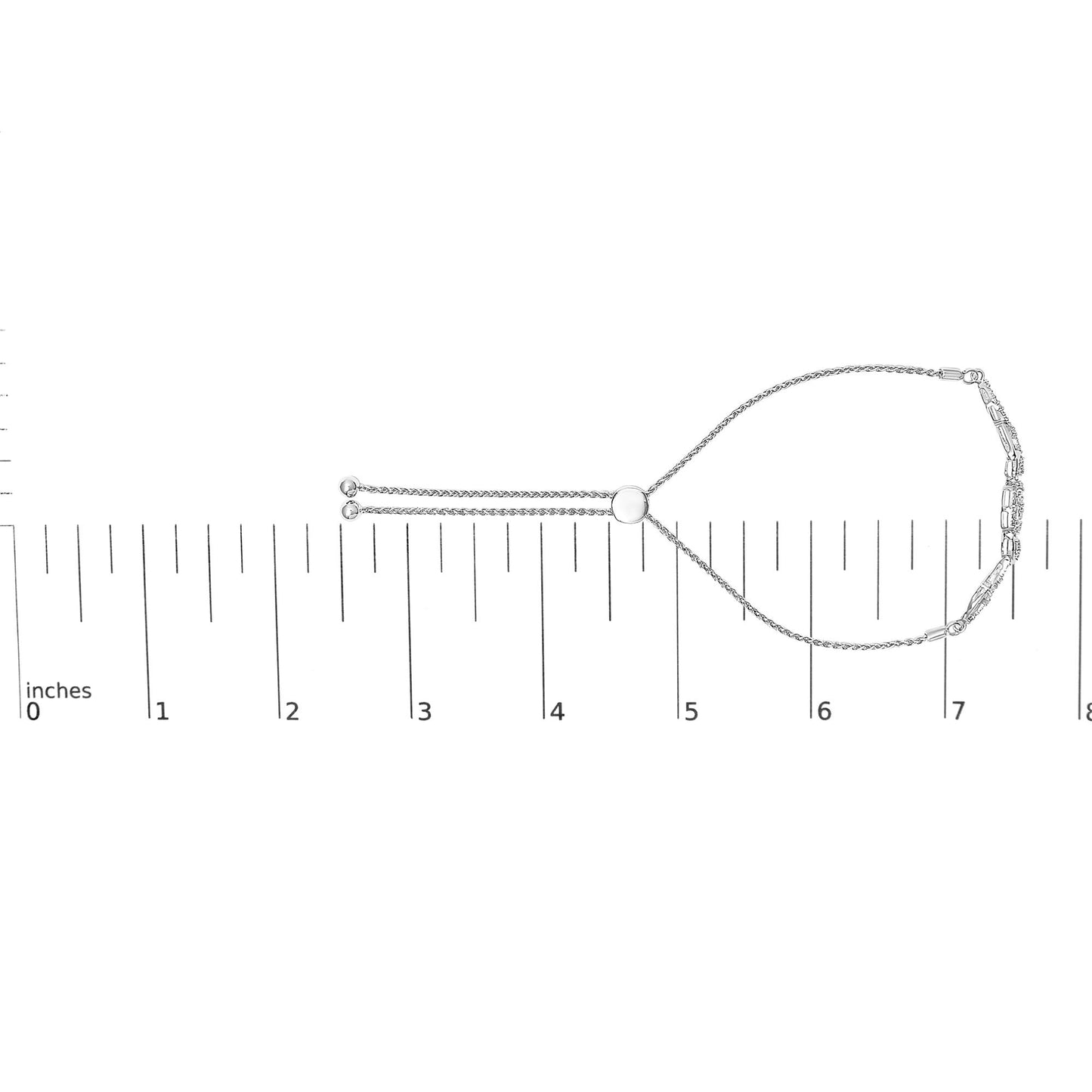 White metal bracelet with white round gemstones in pave setting, displayed flat on a ruler for size reference, shot from above.