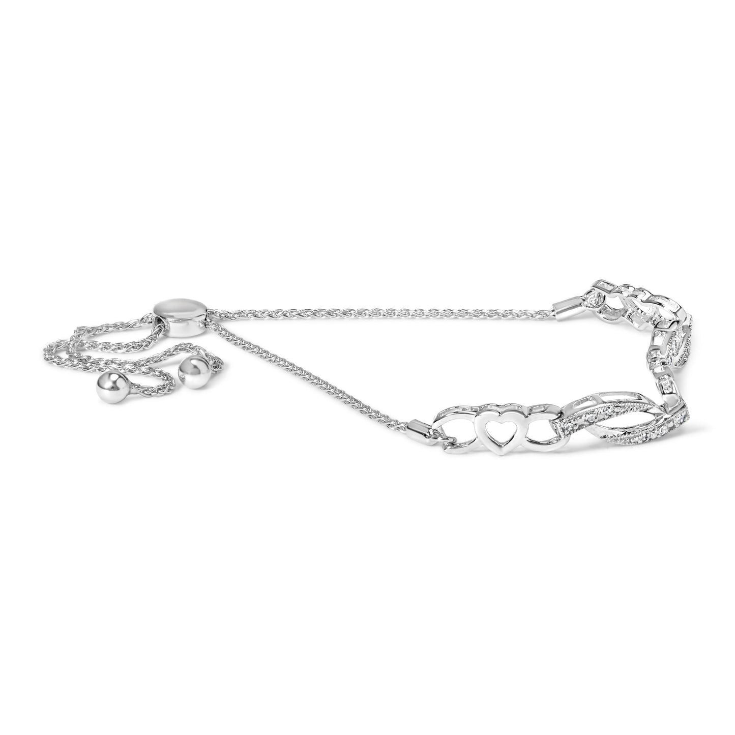 White metal bracelet with heart-shaped links and two rows of twisted links set with round white gemstones, shown from side angle.