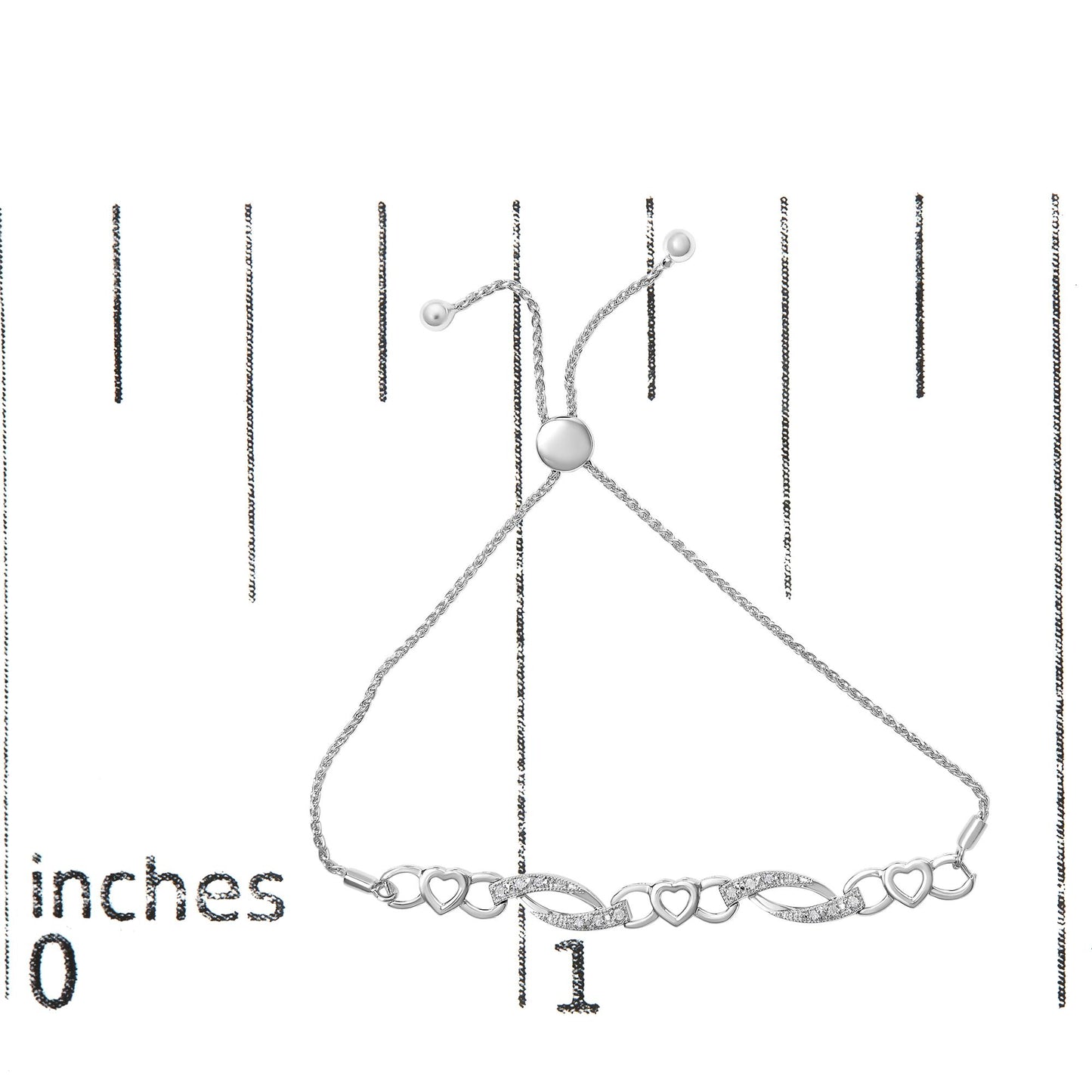 White metal bracelet with intertwined heart shapes and curved links set with small white gemstones, displayed flat on a ruler for size reference, top-down angle.
