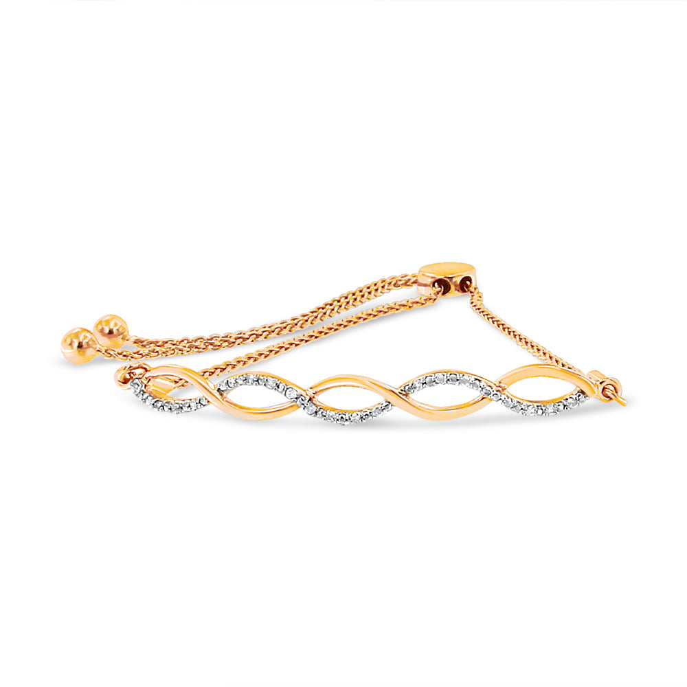Yellow metal bracelet with an intertwined wave design featuring white round gemstones in prong settings, shown in a side angle.
