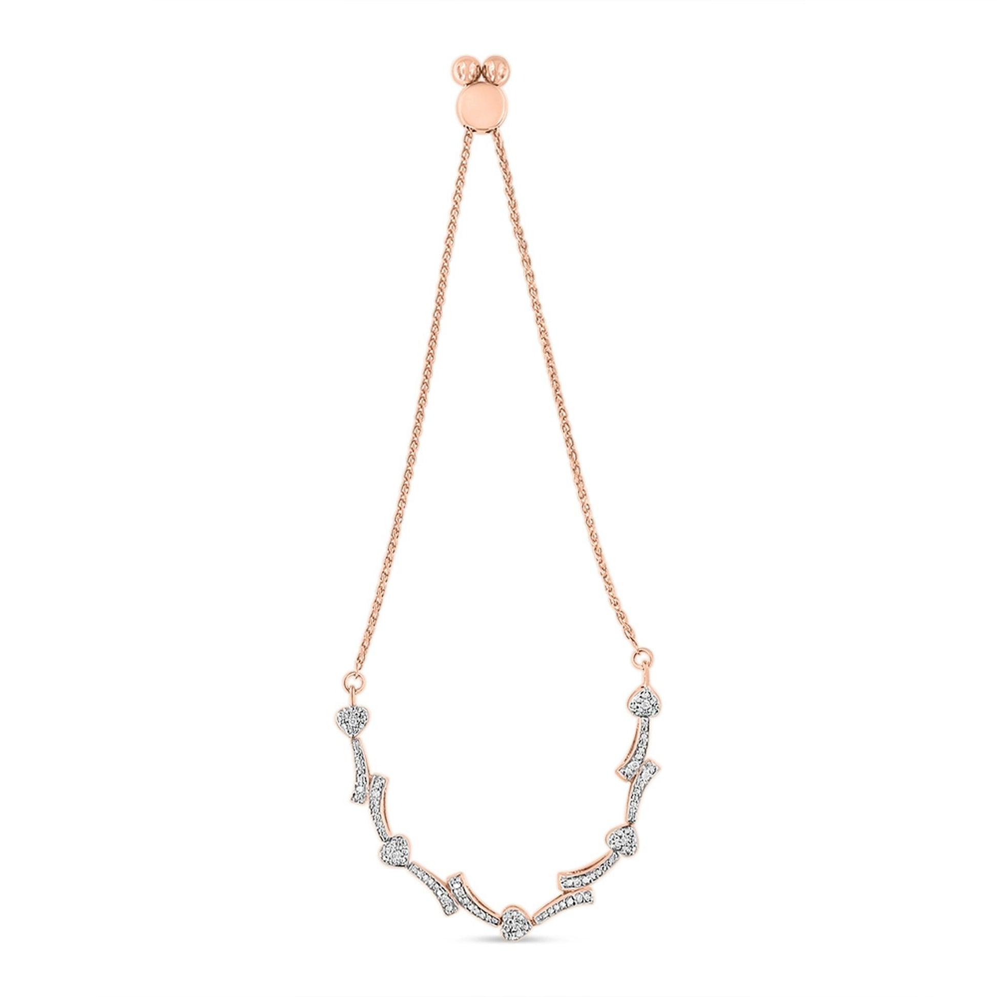 Rose-colored bracelet with heart-shaped and curved segments set with round white gemstones in pave setting, shown from the front on a white background.