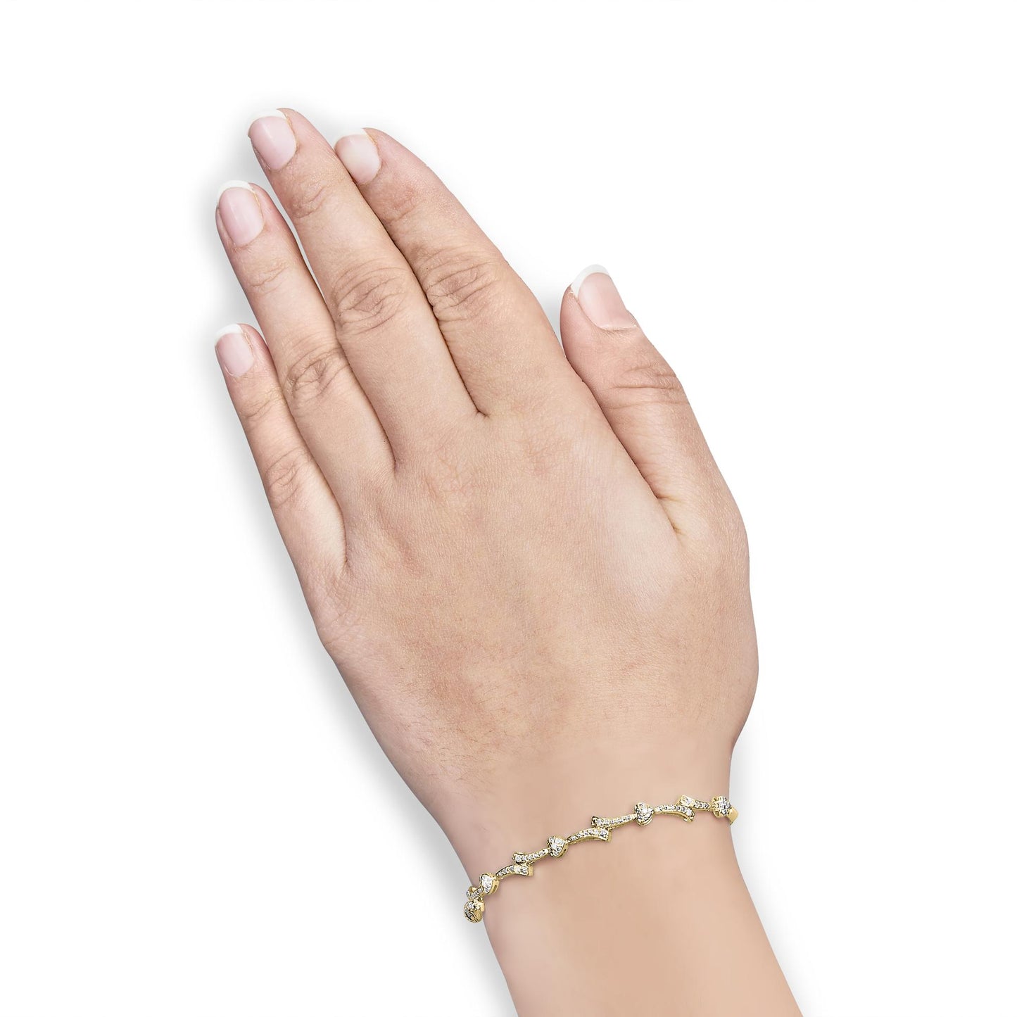 Close-up side view of a yellow bracelet with heart shapes and white round pave set gemstones, worn on a model's wrist.