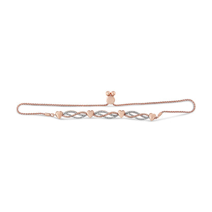 Rose metal bracelet with four heart-shaped links and alternating twisted oval links set with white round pave gemstones, displayed flat in a front-facing horizontal angle.