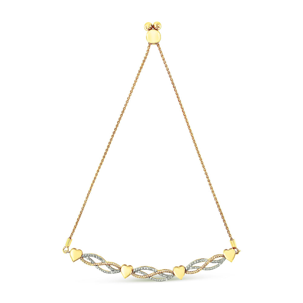 Yellow metal bracelet with alternating heart shapes and twisted links featuring white gemstones, shown flat against a white background from a top-down angle.