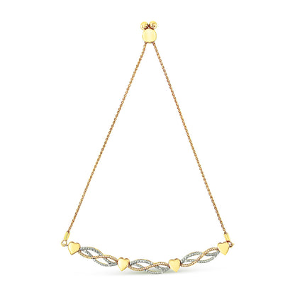 Yellow metal bracelet with alternating heart shapes and twisted links featuring white gemstones, shown flat against a white background from a top-down angle.