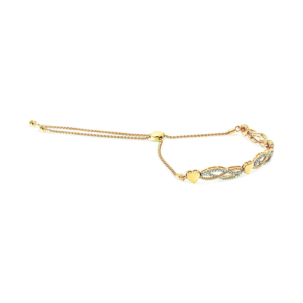 Yellow bracelet with heart accents and pave-set white round gemstones, shown from a side angle.