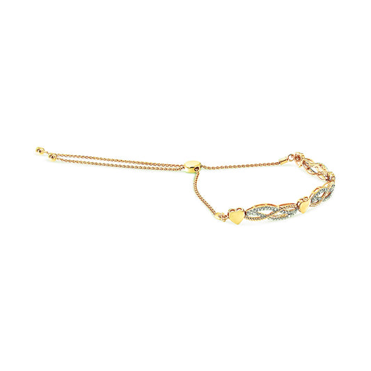 Yellow bracelet with heart accents and pave-set white round gemstones, shown from a side angle.